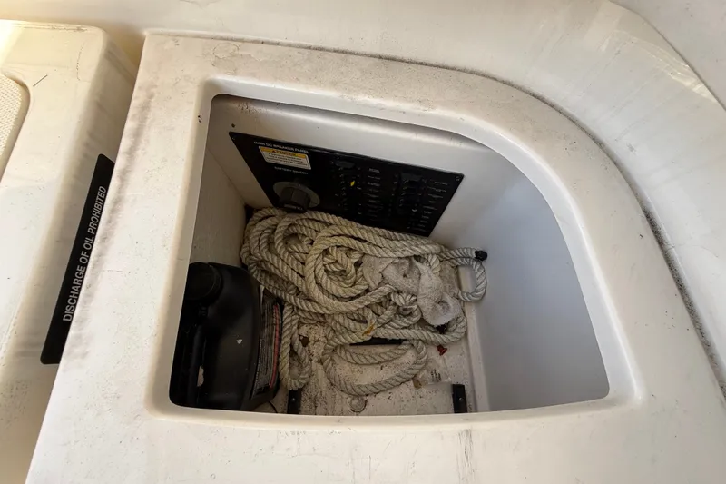 Slide: The Image of Storage compartment with ropes and panel in 2018 Sea Ray Sundancer 350 Coupe. - 85