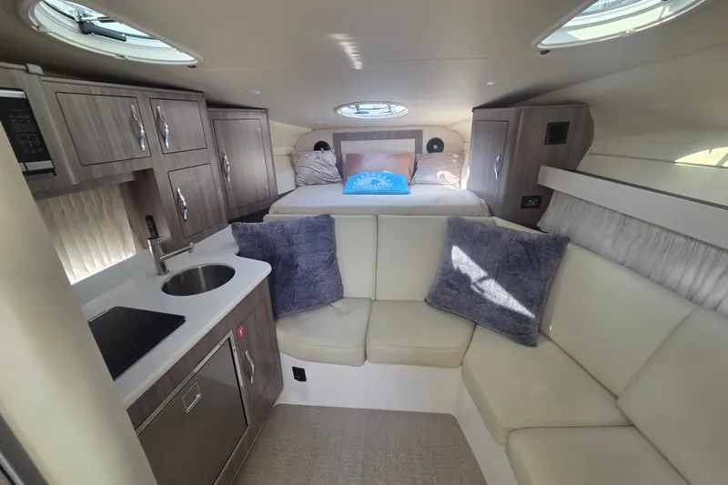 Slide: The Image of Luxurious interior of 2022 Regal 33 Express yacht with cozy seating and modern amenities. - 21