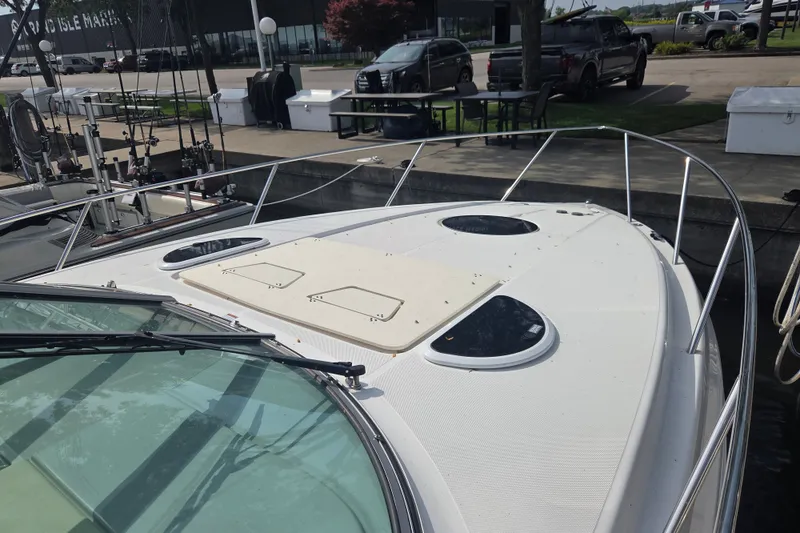 Slide: The Image of 2022 Regal 33 Express boat docked, featuring sleek design and spacious deck. - 30