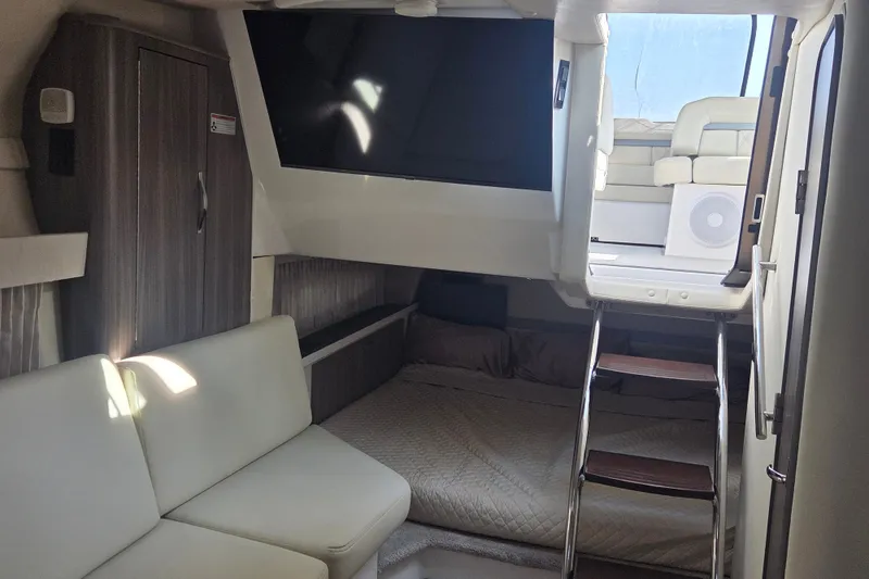 Slide: The Image of Interior of 2022 Regal 33 Express yacht with modern seating and ladder access. - 23
