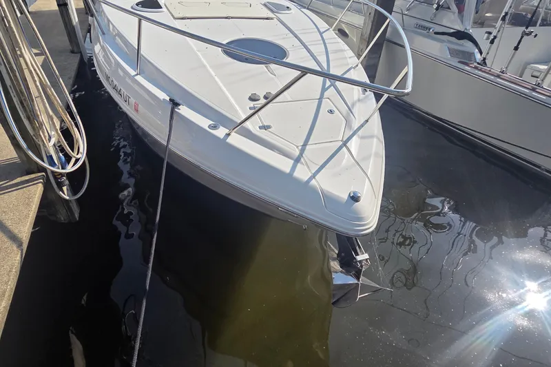 Slide: The Image of 2022 Regal 33 Express boat docked in marina, showcasing sleek design and modern features. - 29
