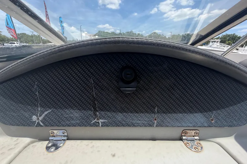 Slide: The Image of Dashboard of a 2018 Stingray 204 LR boat with carbon fiber finish. - 24