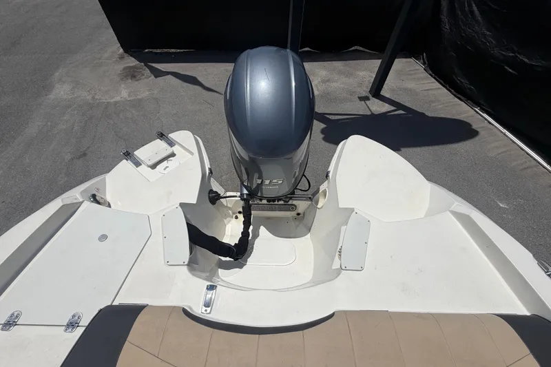 Slide: The Image of 2018 Stingray 204 LR boat with outboard motor, viewed from above. - 57