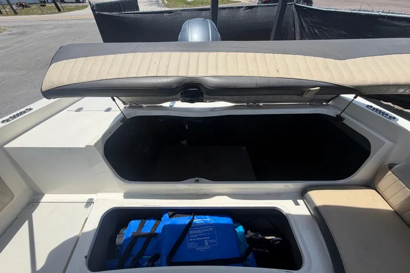 Slide: The Image of Open storage compartment in a 2018 Stingray 204 LR boat, showcasing interior space. - 50