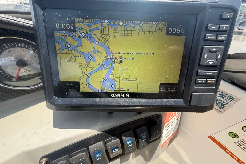 Slide: The Image of Garmin GPS navigation system on a 2018 Stingray 204 LR boat dashboard. - 20