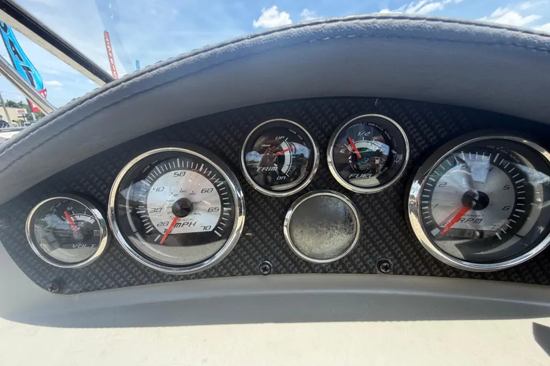 Slide: The Image of Dashboard of a 2018 Stingray 204 LR boat with speedometer and gauges. - 18
