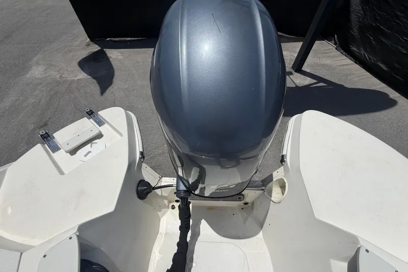 Slide: The Image of 2018 Stingray 204 LR boat with Yamaha outboard motor, viewed from above. - 58