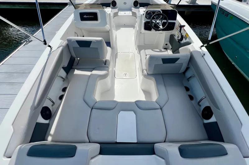 Slide: The Image of 2026 Hurricane SunDeck Sport 2050 OB boat interior with spacious seating and modern dashboard. - 6