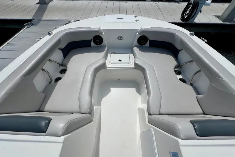 Slide: The Image of 2026 Hurricane SunDeck Sport 2050 OB boat interior with cushioned seating and cup holders. - 8