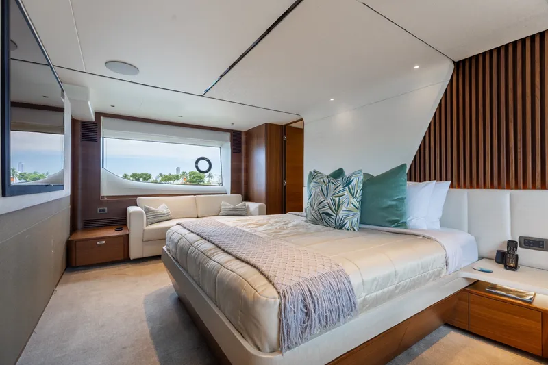 Slide: The Image of Luxurious bedroom interior on 2021 Princess Y85 yacht with modern decor and large window view. - 43