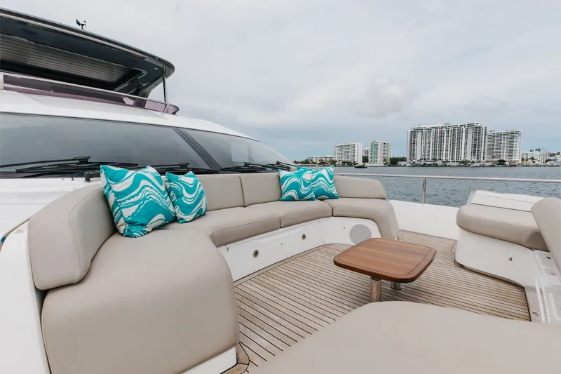 Slide: The Image of Luxurious 2021 Princess Y85 yacht deck with stylish seating and scenic waterfront view. - 66