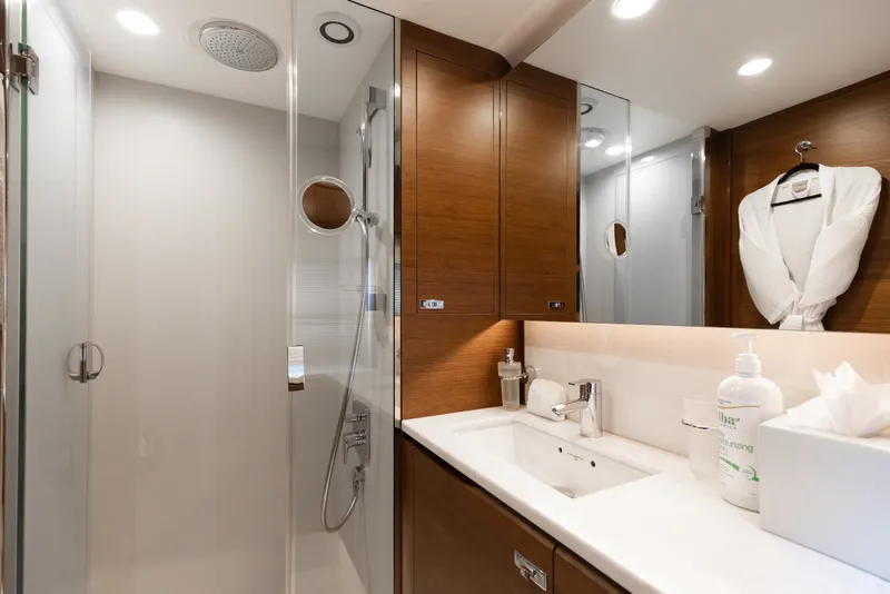 Slide: The Image of Luxurious bathroom in 2021 Princess Y85 yacht with modern fixtures and wooden cabinetry. - 53