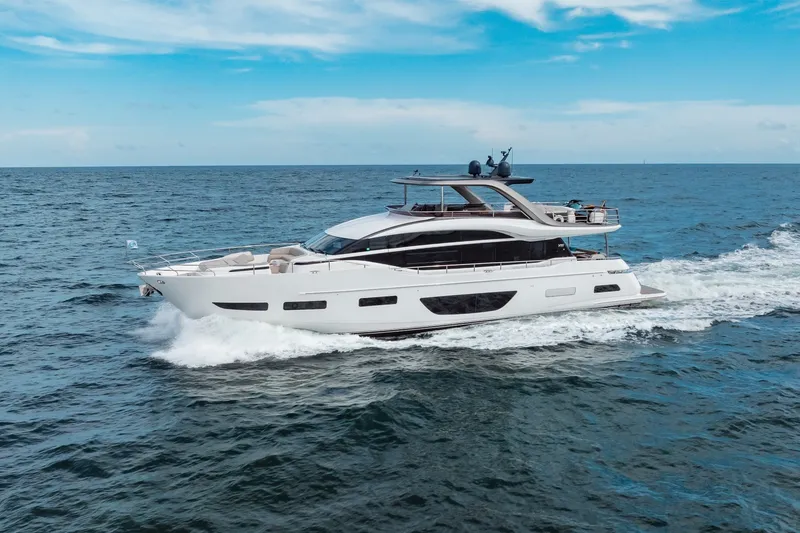 Slide: The Image of Luxurious 2021 Princess Y85 yacht cruising on open sea under clear blue sky. - 15