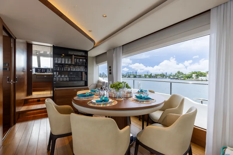 Slide: The Image of Luxurious dining area on 2021 Princess Y85 yacht with elegant table setting and scenic water view. - 31