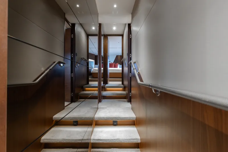 Slide: The Image of Luxurious interior staircase of 2021 Princess Y85 yacht with elegant wood paneling. - 40
