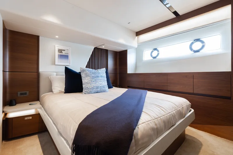 Slide: The Image of Luxurious bedroom interior on 2021 Princess Y85 yacht, featuring elegant wood paneling and modern design. - 50