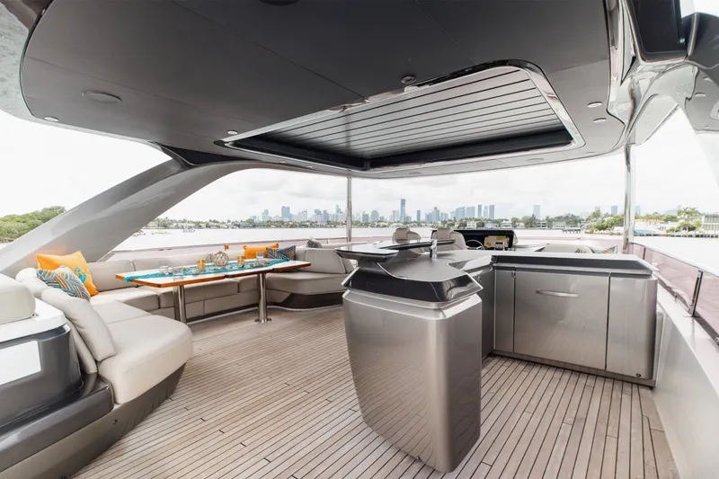Slide: The Image of Luxurious 2021 Princess Y85 yacht deck with modern seating and city skyline view. - 56