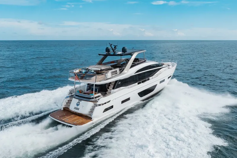 Slide: The Image of Luxurious 2021 Princess Y85 yacht cruising on open sea under clear blue sky. - 5