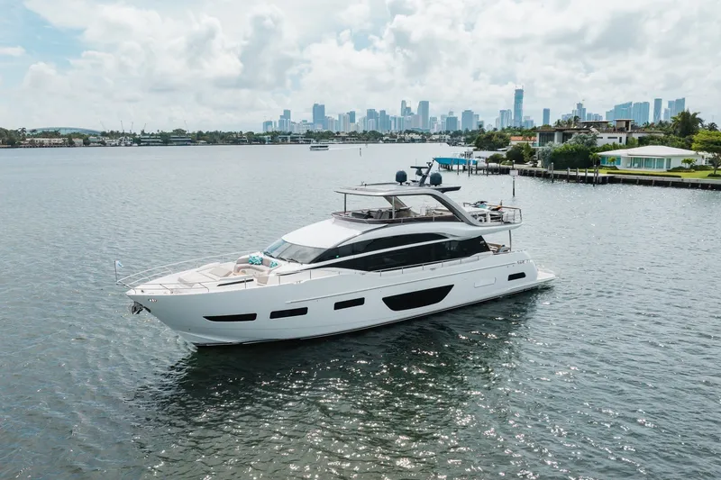Slide: The Image of Luxurious 2021 Princess Y85 yacht cruising near a city skyline on a sunny day. - 8
