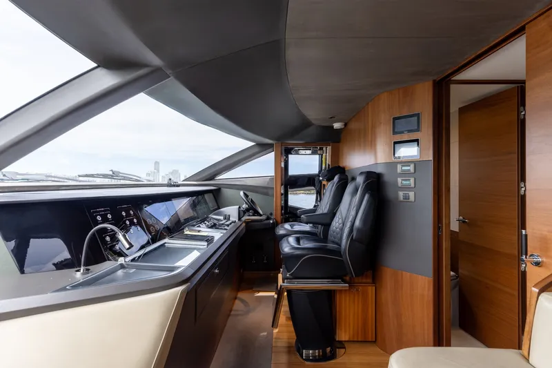 Slide: The Image of Luxurious interior of 2021 Princess Y85 yacht cockpit with modern controls and seating. - 38