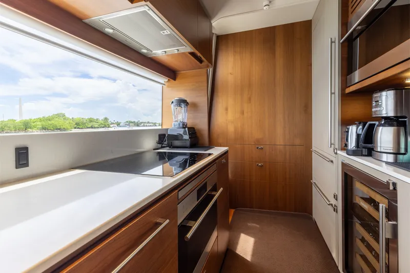 Slide: The Image of Luxurious kitchen interior of 2021 Princess Y85 yacht with modern appliances and scenic window view. - 35