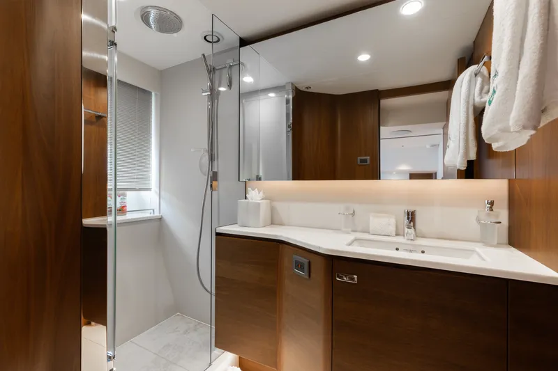 Slide: The Image of Luxurious bathroom in 2021 Princess Y85 yacht with modern fixtures and elegant wood finishes. - 51