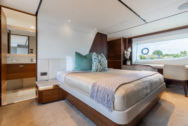 Slide: The Image of Luxurious bedroom interior on 2021 Princess Y85 yacht, featuring elegant decor and large window view. - 42