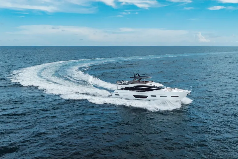 Slide: The Image of Luxurious 2021 Princess Y85 yacht cruising on open sea under clear blue sky. - 16