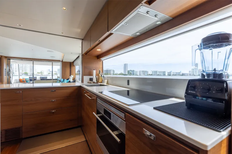 Slide: The Image of Luxurious kitchen interior of 2021 Princess Y85 yacht with modern appliances and cityscape view. - 36