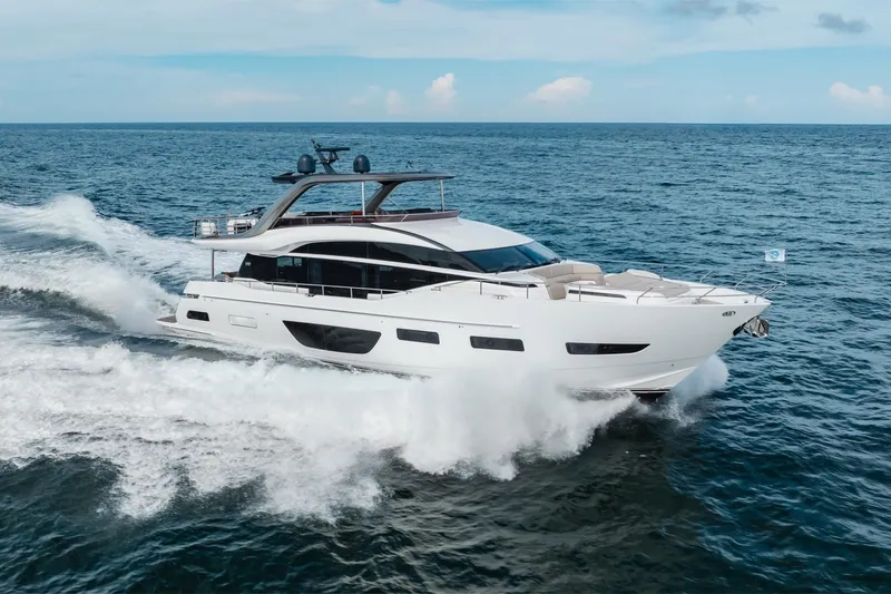 Slide: The Image of Luxurious 2021 Princess Y85 yacht cruising on open sea under clear skies. - 1