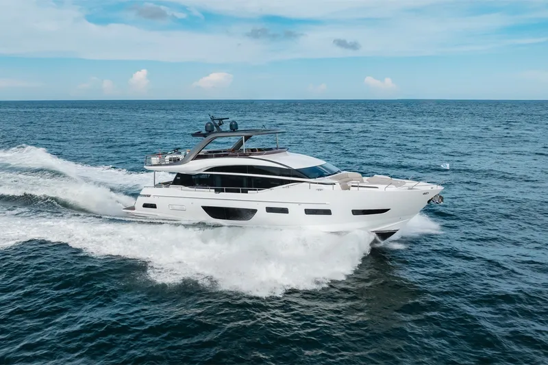 Slide: The Image of Luxurious 2021 Princess Y85 yacht cruising on open sea under clear blue sky. - 17