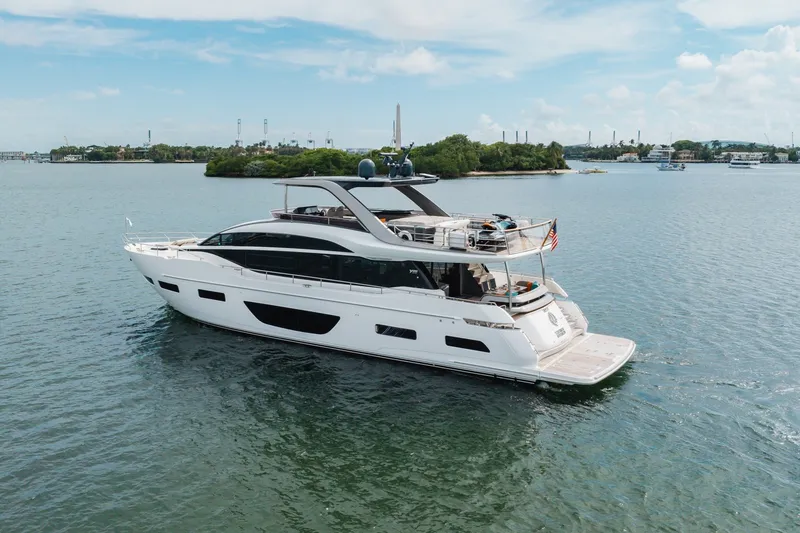 Slide: The Image of Luxurious 2021 Princess Y85 yacht cruising on serene waters under a clear sky. - 10