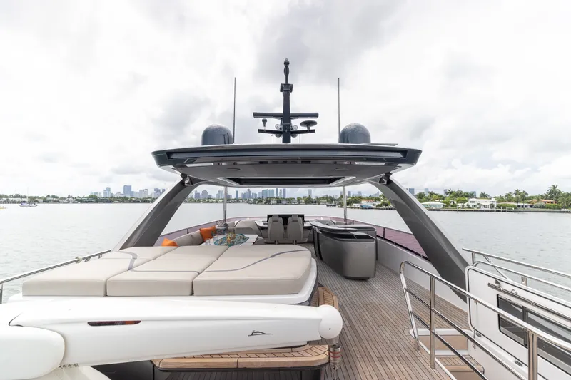 Slide: The Image of Luxurious 2021 Princess Y85 yacht deck with spacious seating and scenic waterfront view. - 58