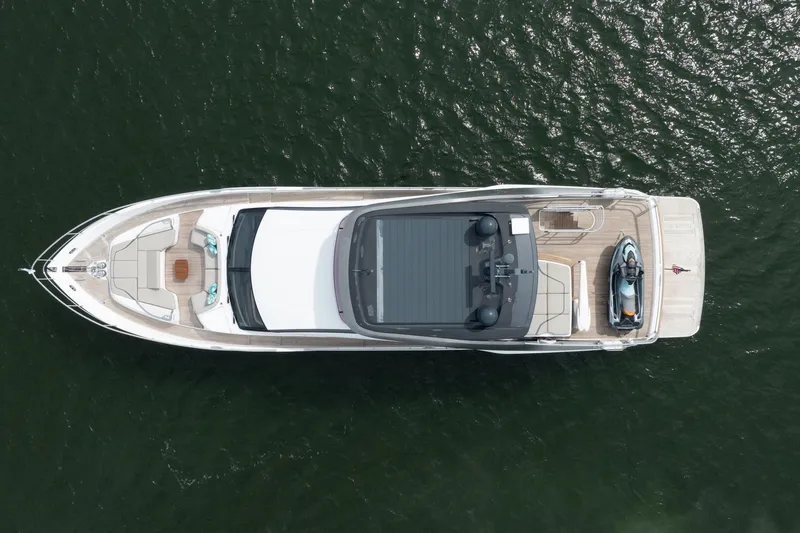 Slide: The Image of Aerial view of 2021 Princess Y85 yacht on water, showcasing deck and seating areas. - 18