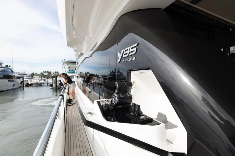Slide: The Image of Luxury 2021 Princess Y85 yacht docked at marina, showcasing sleek design and modern features. - 4