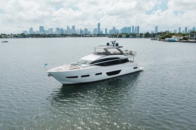 Slide: The Image of Luxurious 2021 Princess Y85 yacht cruising near a city skyline on a sunny day. - 14