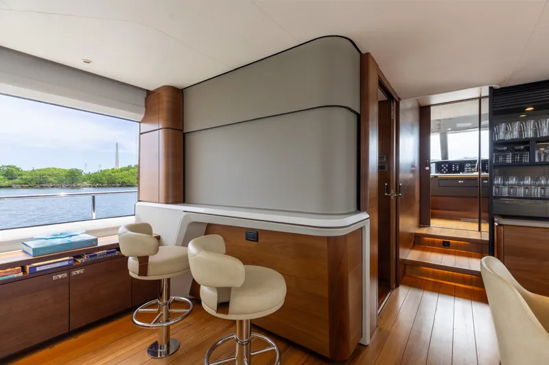 Slide: The Image of Luxurious interior of 2021 Princess Y85 yacht with elegant seating and scenic water view. - 34