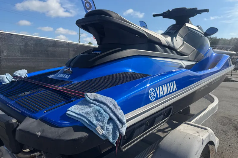 Slide: The Image of 2018 Yamaha WaveRunner EX Deluxe in blue on a trailer, ready for adventure. - 32