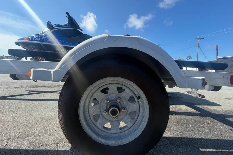 Slide: The Image of 2018 Yamaha WaveRunner EX Deluxe on trailer under clear blue sky. - 38