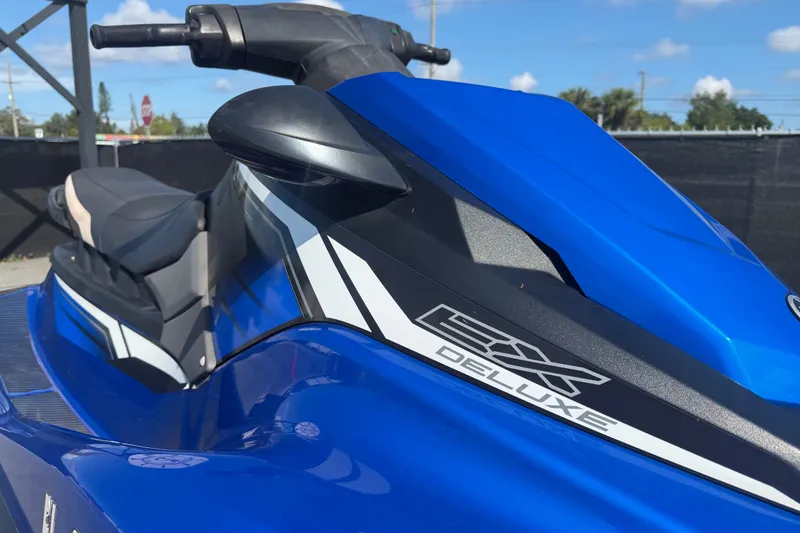 Slide: The Image of 2018 Yamaha WaveRunner EX Deluxe in vibrant blue, close-up view. - 34
