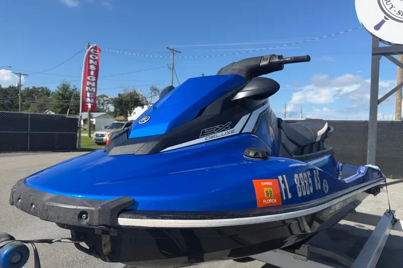 Slide: The Image of 2018 Yamaha WaveRunner EX Deluxe in blue, parked outdoors on a trailer. - 27