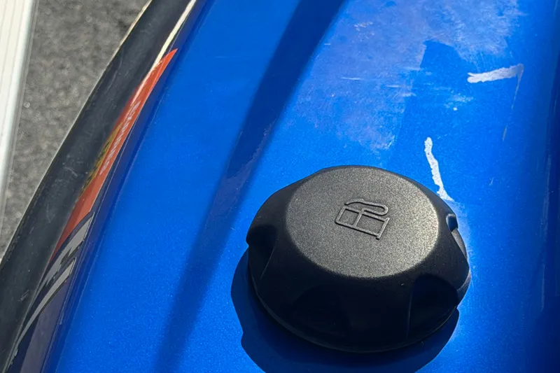 Slide: The Image of Close-up of a 2018 Yamaha WaveRunner EX Deluxe fuel cap on a blue surface. - 22