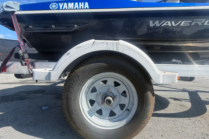 Slide: The Image of 2018 Yamaha WaveRunner EX Deluxe on trailer, showcasing wheel and hull details. - 37