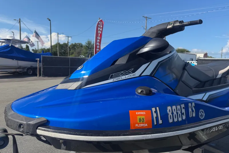 Slide: The Image of 2018 Yamaha WaveRunner EX Deluxe in blue, parked outdoors with Florida registration. - 28