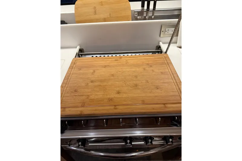 Slide: The Image of Cutting board on Jeanneau Sun Odyssey 490 yacht kitchen, 2020 model. - 31