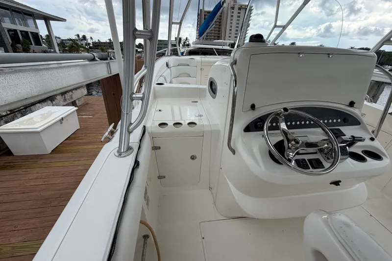 Slide: The Image of 2007 Boston Whaler 320 Outrage boat interior with steering console and seating. - 28
