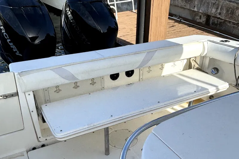 Slide: The Image of 2007 Boston Whaler 320 Outrage boat interior with dual Mercury engines. - 33