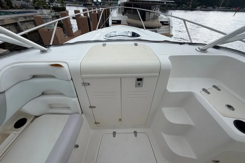 Slide: The Image of 2007 Boston Whaler 320 Outrage boat interior with seating and storage compartments. - 52