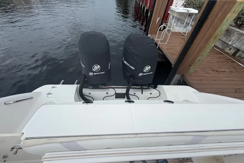 Slide: The Image of 2007 Boston Whaler 320 Outrage with dual Mercury engines at dockside. - 56