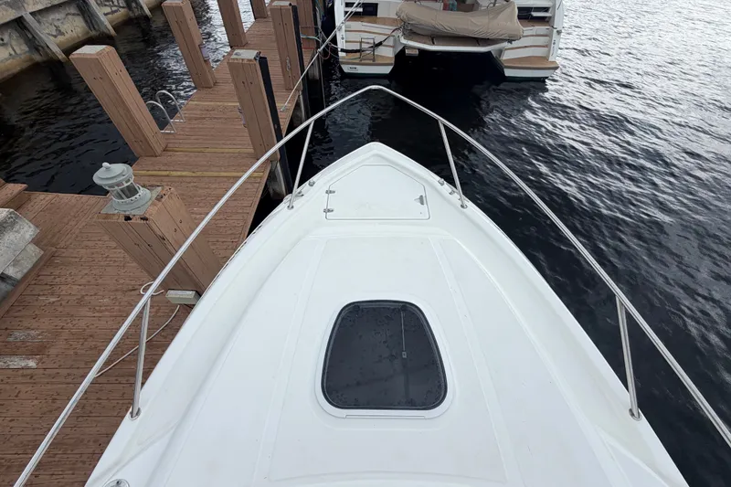 Slide: The Image of Bow view of a 2007 Boston Whaler 320 Outrage docked at a marina. - 8